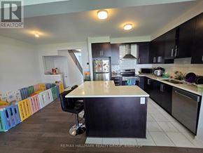 Ottawa townhouse for rent - A kitchen with a black counter and a white island.
