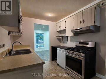 St. Catharines (Lakeport) apartment for rent - A kitchen with a stove and sink.
