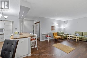 Prescott condo for rent - A well-lit, modern kitchen and living room with a dining table and chairs.