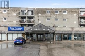Prescott condo for rent - A blue car is parked in front of a building with a sign that reads "Water & A.".