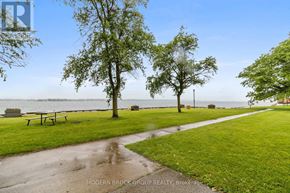 Prescott condo for rent - A park with a bench and trees near a body of water.