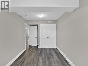 Essex duplex for rent - A hallway with two doors and a wooden floor.