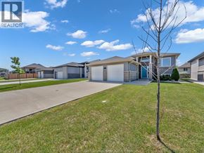 Essex duplex for rent - A realtor photo of a house with a tree in front.