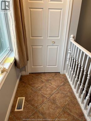 Windsor apartment for rent - A white door with a small square plate on it.