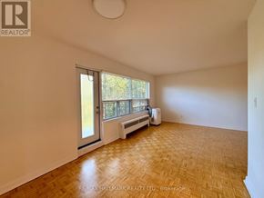 Toronto (St. Andrew-Windfields) condo for rent - A room with a sliding glass door leading to a balcony.