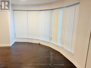 Toronto (Waterfront Communities) condo for rent - A room with a white blind on the window.
