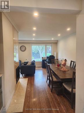 Toronto (Bayview Village) apartment for rent - A dining room with a wooden table and chairs.
