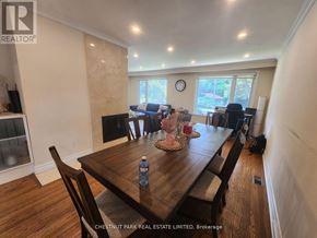 Toronto (Bayview Village) apartment for rent - A dining room with a wooden table and chairs.