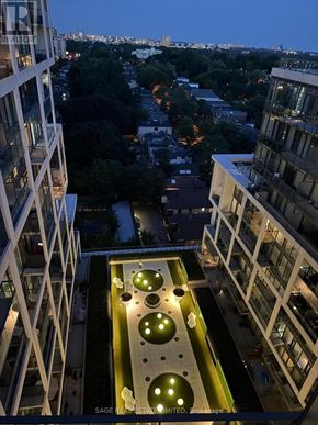 Toronto (Mount Pleasant West) condo for rent - A view from a high-rise building looking down at a courtyard with circular lights.