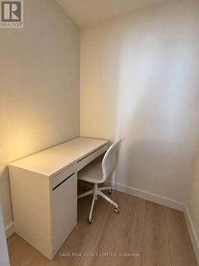 Toronto (Mount Pleasant West) condo for rent - A white desk with a drawer and a chair in a room.