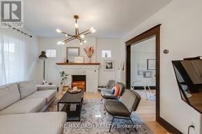 Toronto (Woodbine-Lumsden) apartment for rent - A living room with a fireplace and a couch.