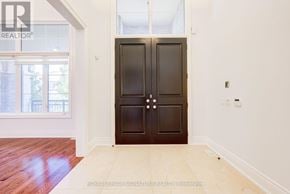 King (Nobleton) apartment for rent - A room with a wooden floor and a large double door.