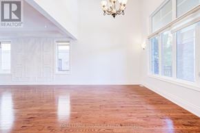 King (Nobleton) apartment for rent - A room with wooden floors and a chandelier.