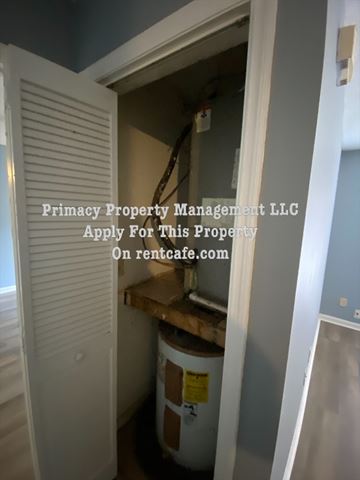 Columbia apartment for rent - A small, white closet with a door open to a kitchen area.