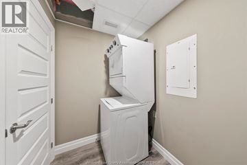 Windsor condo for rent - A white dishwasher is in a small kitchen.