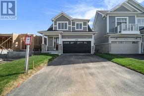Loyalist (Bath) apartment for rent - A house with a garage and a sign in front of it.