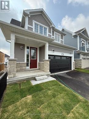 Loyalist (Bath) apartment for rent - A house with a red door and a garage door.