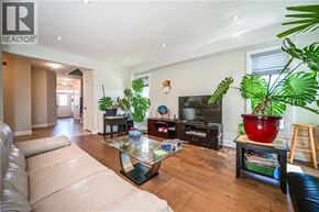 Waterloo apartment for rent - A living room with a couch, a coffee table, and a television.