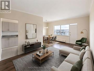 Toronto (Parkwoods-Donalda) condo for rent - A well-lit, modern living room with a coffee table in the center.