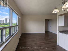 Toronto (Parkwoods-Donalda) condo for rent - A room with a view of the city through the windows.