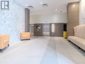 Toronto (Woodbine Corridor) condo for rent - A spacious waiting area with a reception desk and two seating options.