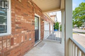 Milton (Wi Willmott) townhouse for rent - A red brick house with a white door and a white railing.