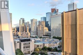 Toronto (Kensington-Chinatown) condo for rent - A cityscape with tall buildings and a clear sky.