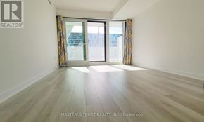Toronto (Kensington-Chinatown) condo for rent - A room with a sliding glass door and wooden flooring.