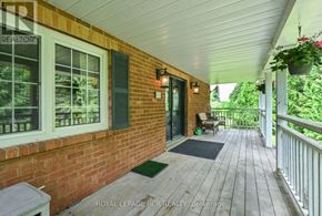 Caledon (Caledon Village) apartment for rent - A porch with a white railing and a brick wall.