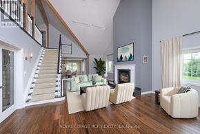 Caledon (Caledon Village) apartment for rent - A living room with a staircase and a fireplace.