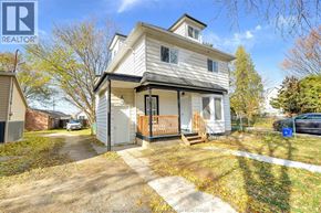 Windsor apartment for rent - A two-story house with a white exterior and a small front porch.
