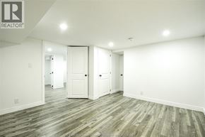 Windsor apartment for rent - A room with wooden flooring and white walls.