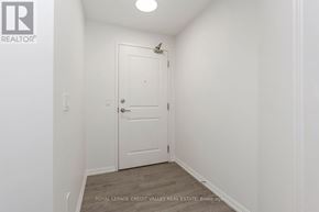 Toronto (Niagara) condo for rent - A white door is in a white room.