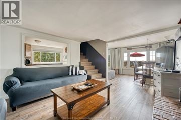 Harrow apartment for rent - A living room with a grey couch and a wooden coffee table.
