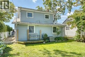 Harrow apartment for rent - A small house with a porch and a tree in front.