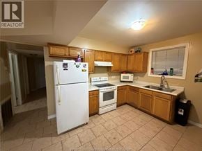 Windsor apartment for rent - A kitchen with a white refrigerator, stove, and sink.