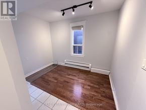 Toronto (North Riverdale) apartment for rent - A room with a window and wooden flooring.