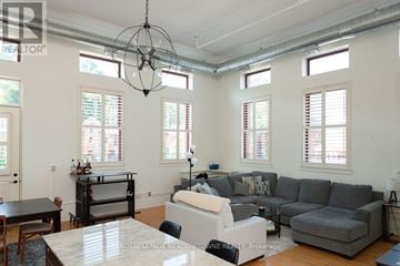 Hamilton (Stinson) condo for rent - A living room with a grey couch and a television.