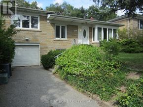 Toronto (Willowdale West) apartment for rent - A house with a garage and a driveway.