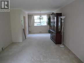 Toronto (Willowdale West) apartment for rent - A room with a window and a wooden cabinet.