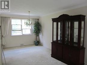 Toronto (Willowdale West) apartment for rent - A room with a large cabinet and a potted plant.