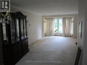 Toronto (Willowdale West) apartment for rent - A room with a chandelier and a cabinet is for sale.