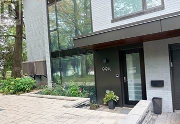 Toronto (Rosedale-Moore Park) townhouse for rent - A modern house with a glass door and a number 99A on it.
