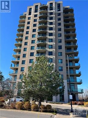 Ottawa condo for rent - A tall residential building with balconies on the upper floors.