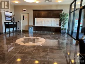 Ottawa condo for rent - A reception area with a circular design on the floor.