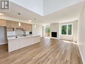 Russell townhouse for rent - A spacious kitchen with wooden floors and a large island.