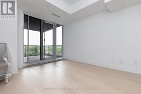 Toronto (Yonge-Eglinton) condo for rent - A spacious room with a large window and sliding glass doors.