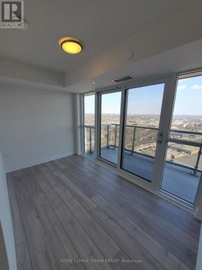 Toronto (Agincourt South-Malvern West) condo for rent - A room with a large window overlooking a cityscape.