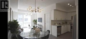 Toronto (Rouge) townhouse for rent - A modern kitchen with a dining table and chairs.
