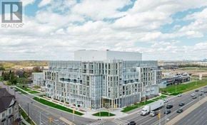 Oakville (Jm Joshua Meadows) condo for rent - A large glass building with the REALTOR logo on it.